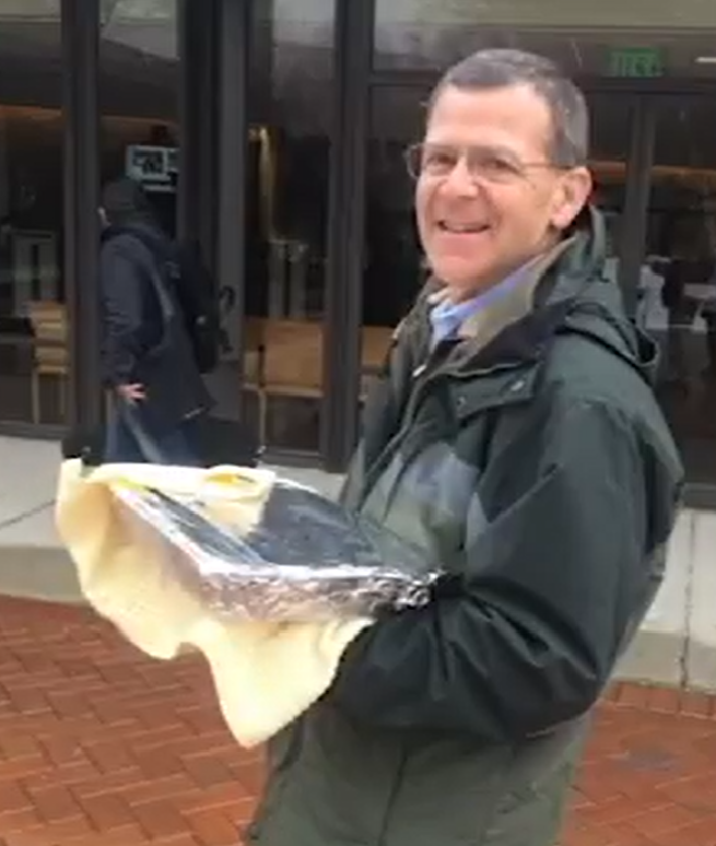 Man carrying casserole pan