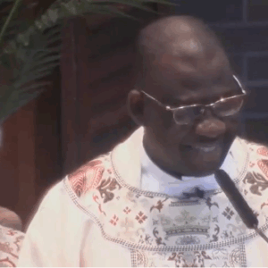 Fr. Ferdinand & Fr. Gerry smile at Fr. Ferdinand's final Mass at St. John's