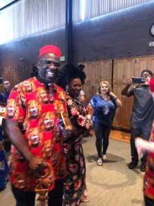 Fr. Ferdinand leads the dancing following his final Mass at St. John's